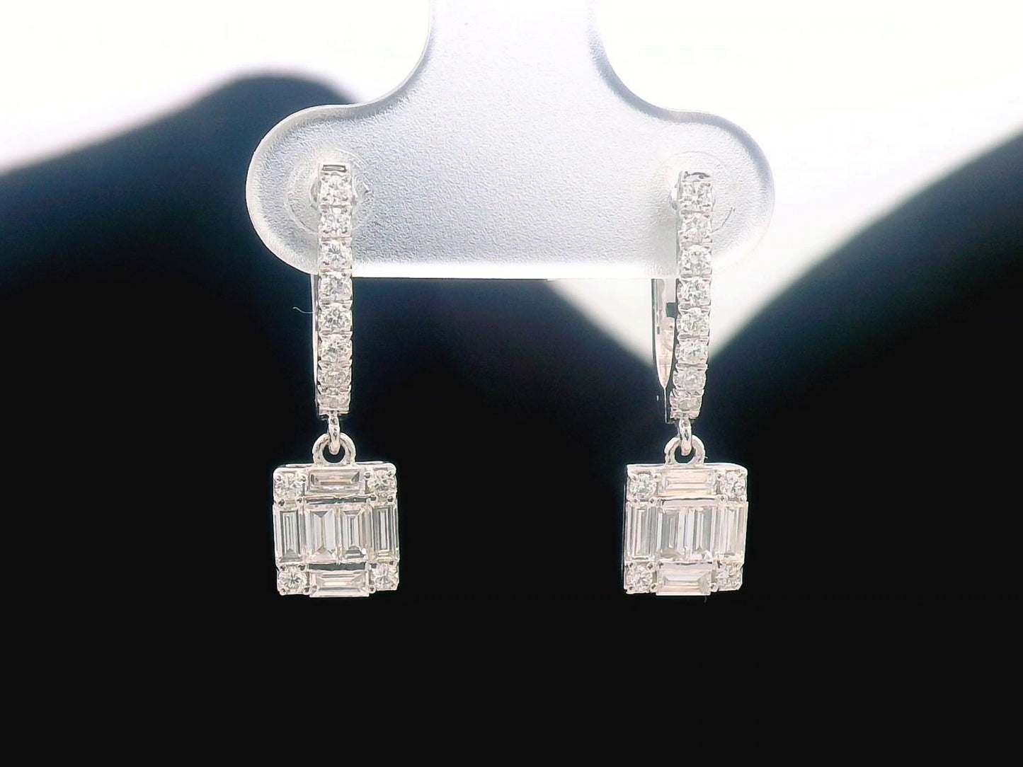 18K gold diamond drop earrings with square baguette and round diamonds.