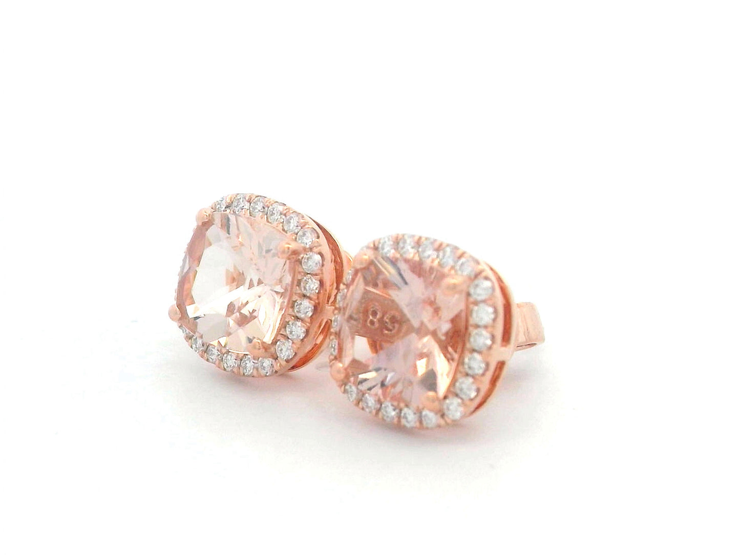 18K rose gold stud earrings with cushion-cut morganites and a diamond halo.