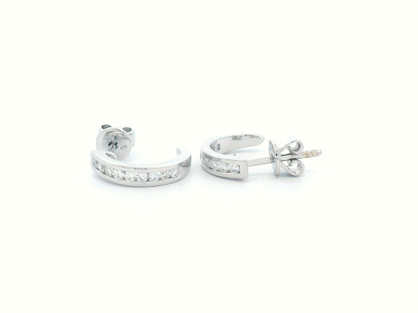 18K gold diamond huggie hoop earrings with channel-set diamonds and butterfly push-back closure.