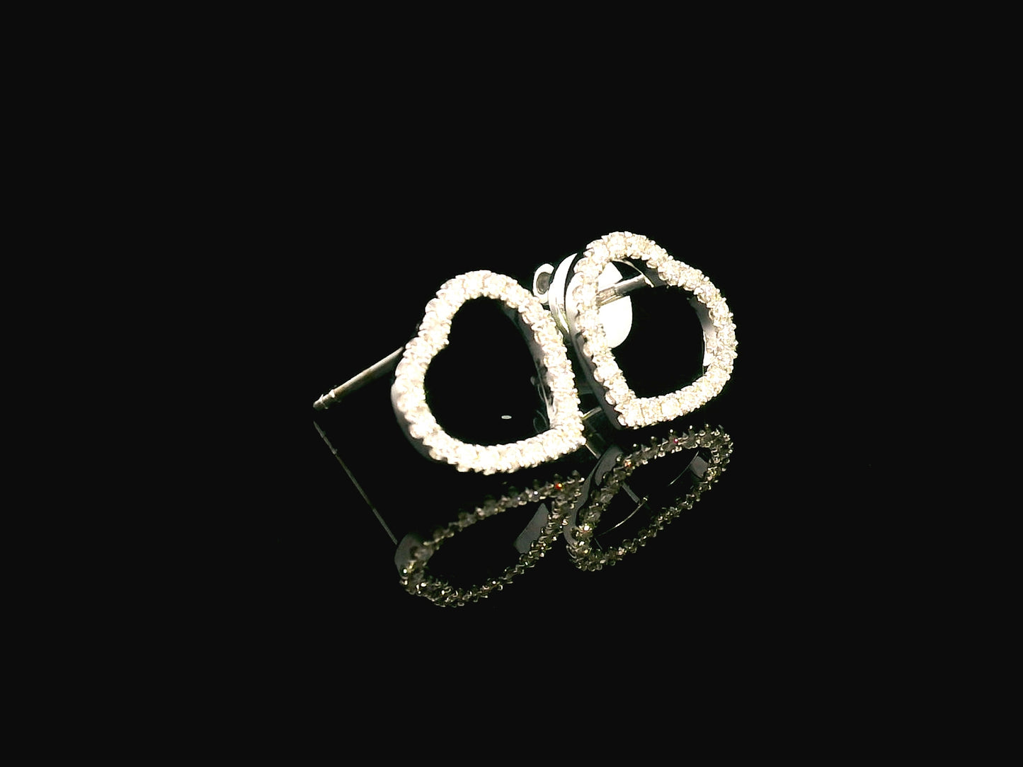 18K white gold diamond heart stud earrings with 0.27 carat round diamonds, elegant and romantic jewelry piece.