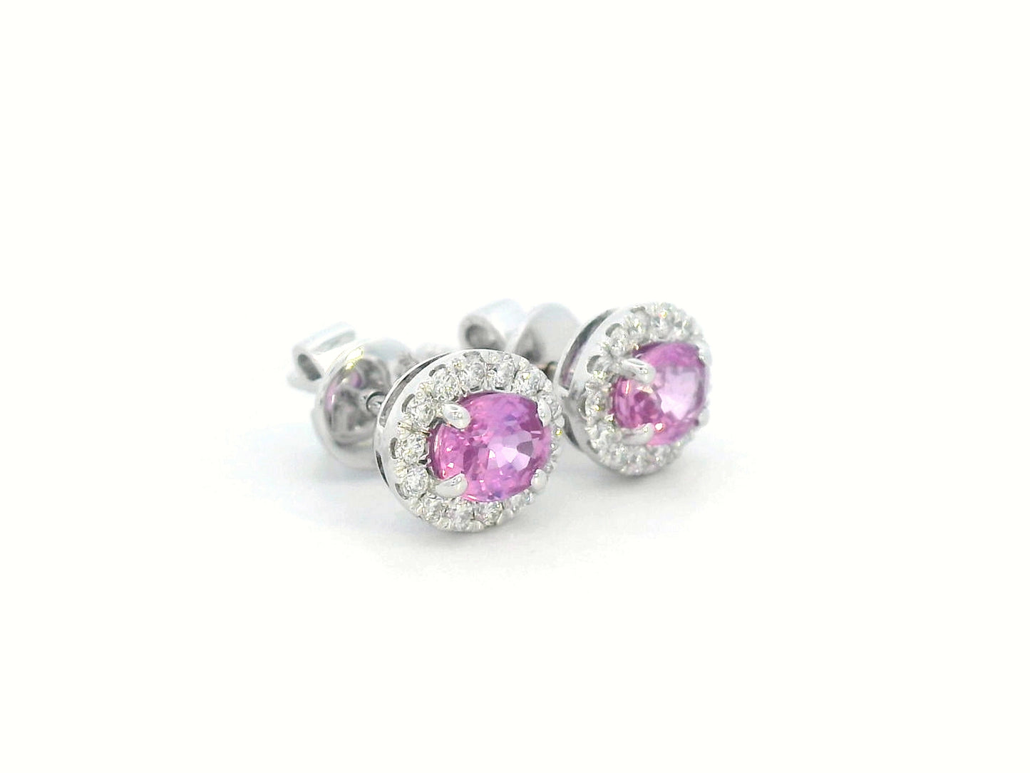 18K white gold oval pink sapphire and diamond halo stud earrings with butterfly push-back closure.