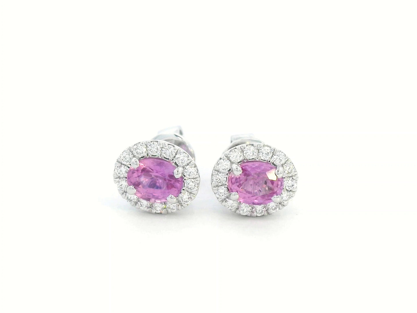 18K white gold oval pink sapphire and diamond halo stud earrings with butterfly push-back closure.