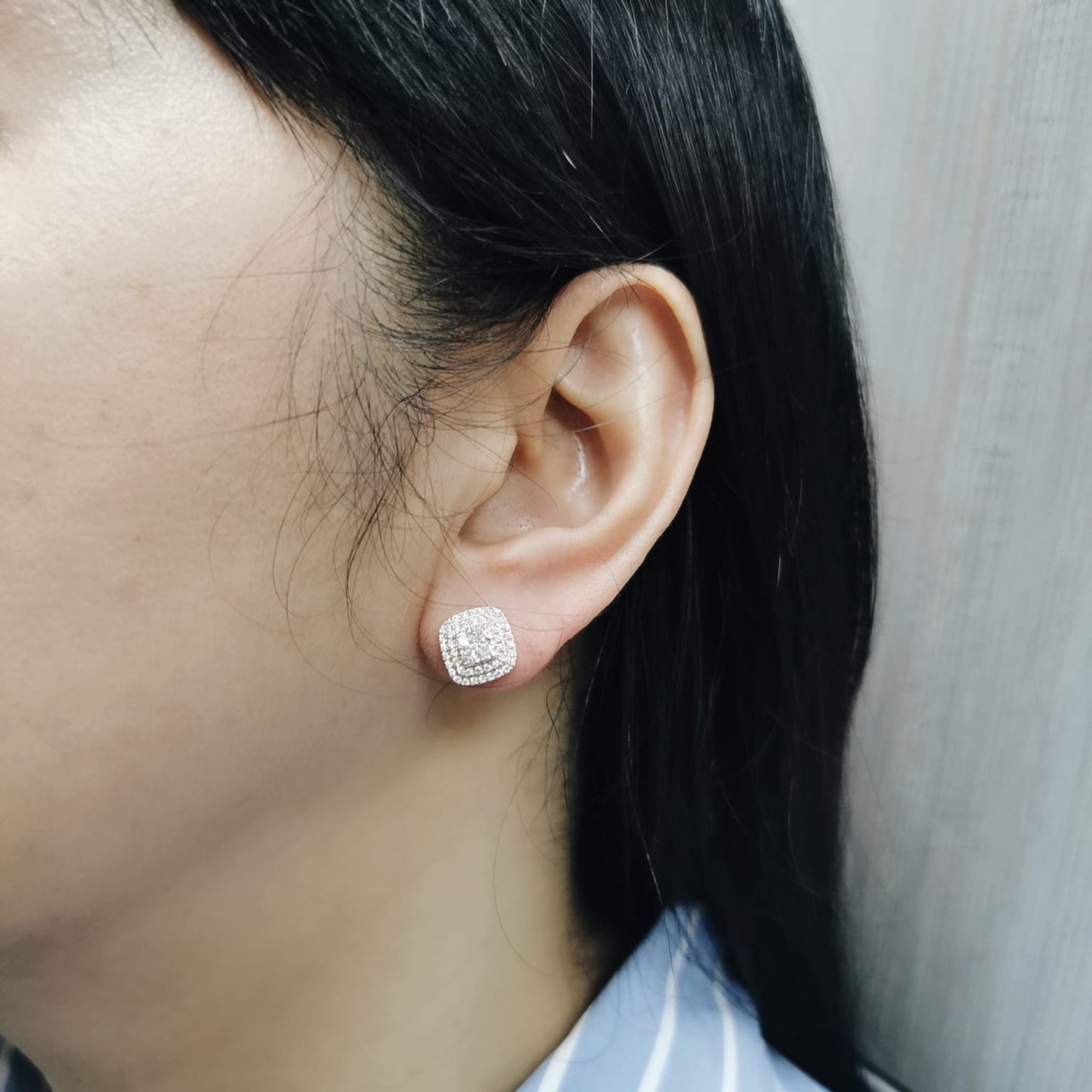 18K gold cushion-shaped diamond stud earrings with double halo, 0.76 carats total.