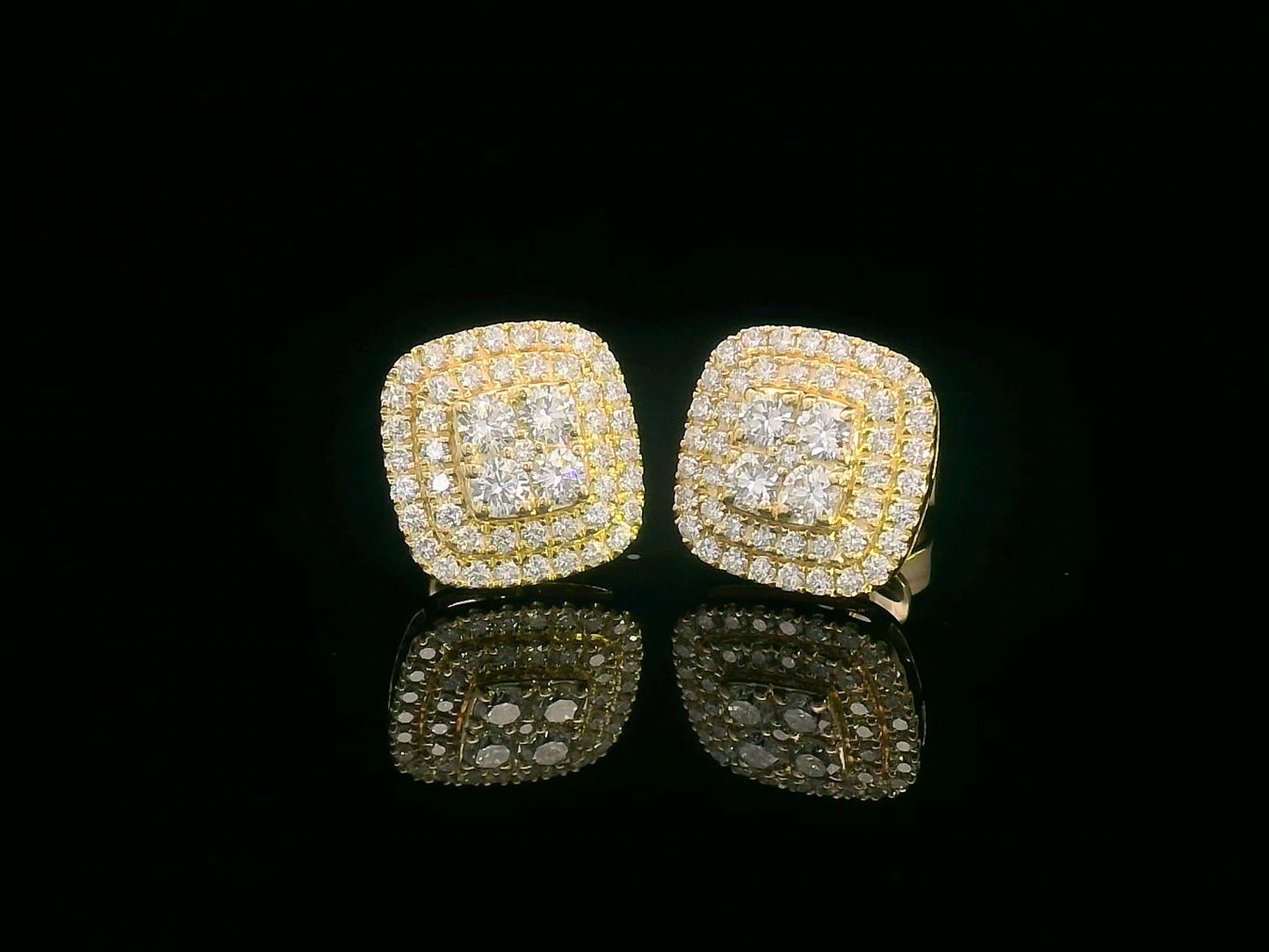 18K gold cushion-shaped diamond stud earrings with double halo, 0.76 carats total.
