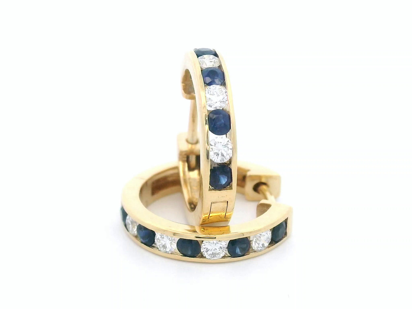 18K gold sapphire and diamond hoop earrings with alternating gemstones.