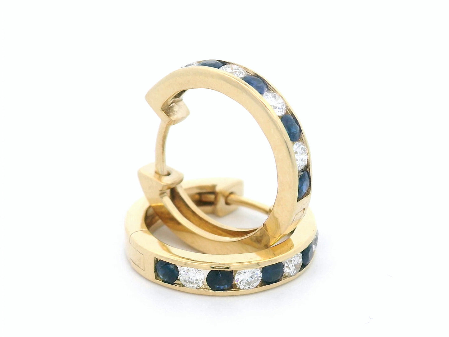 18K gold sapphire and diamond hoop earrings with alternating gemstones.