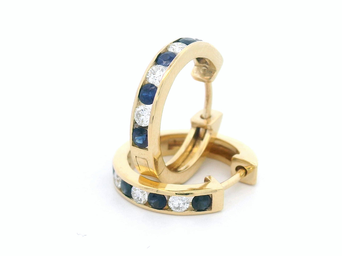 18K gold sapphire and diamond hoop earrings with alternating gemstones.