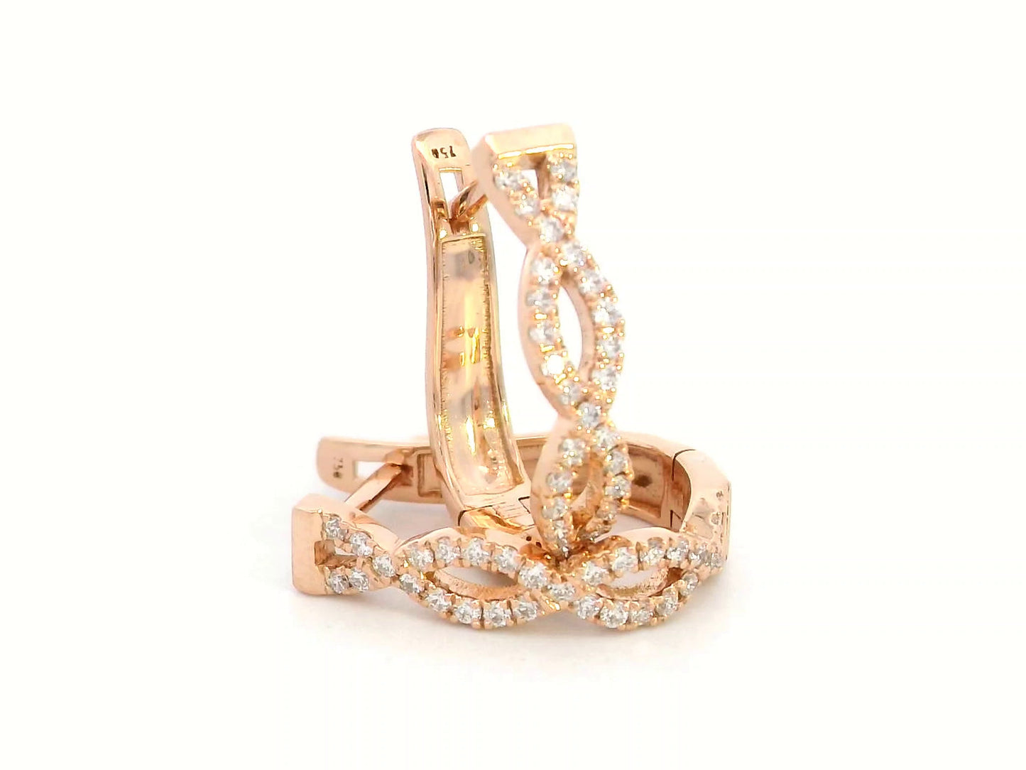18K gold hoop earrings with diamonds in a twisted infinity design.