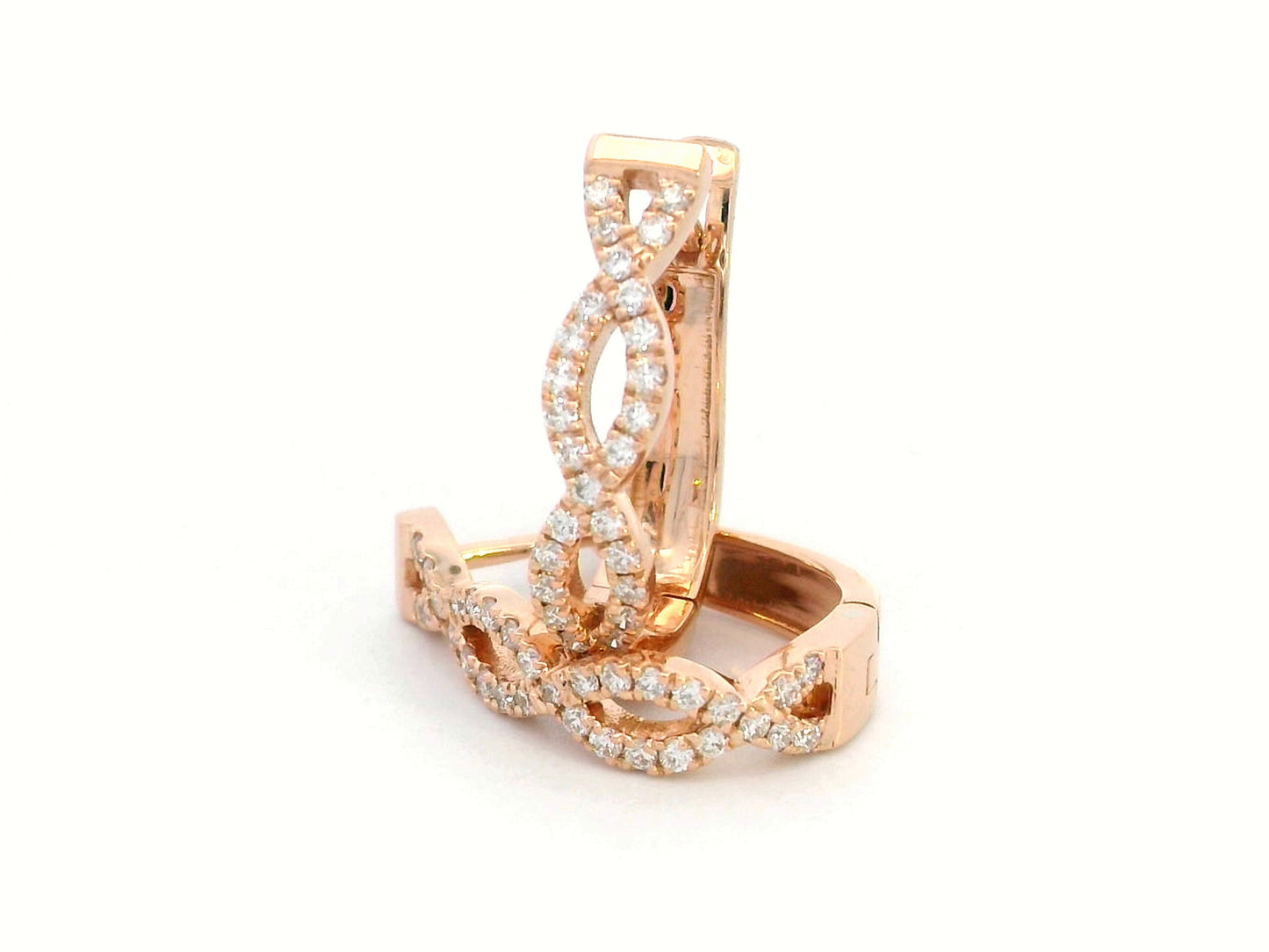 18K gold hoop earrings with diamonds in a twisted infinity design.