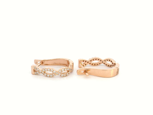 18K gold hoop earrings with diamonds in a twisted infinity design.