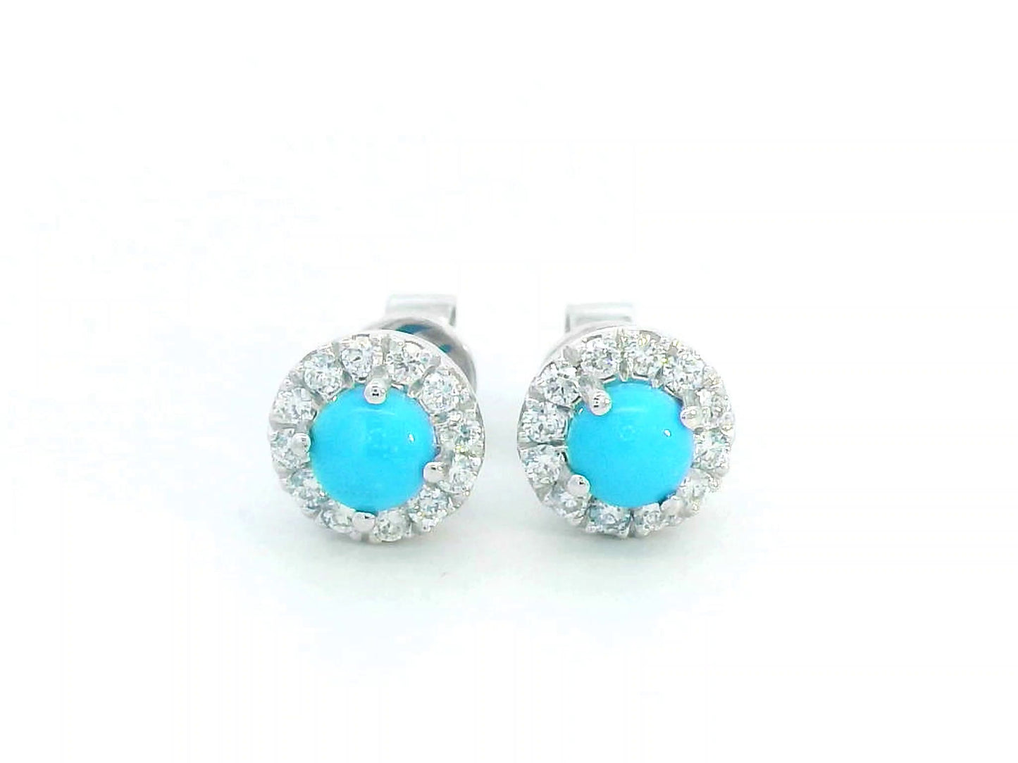18K white gold stud earrings with round turquoise centers and diamond halo accents.