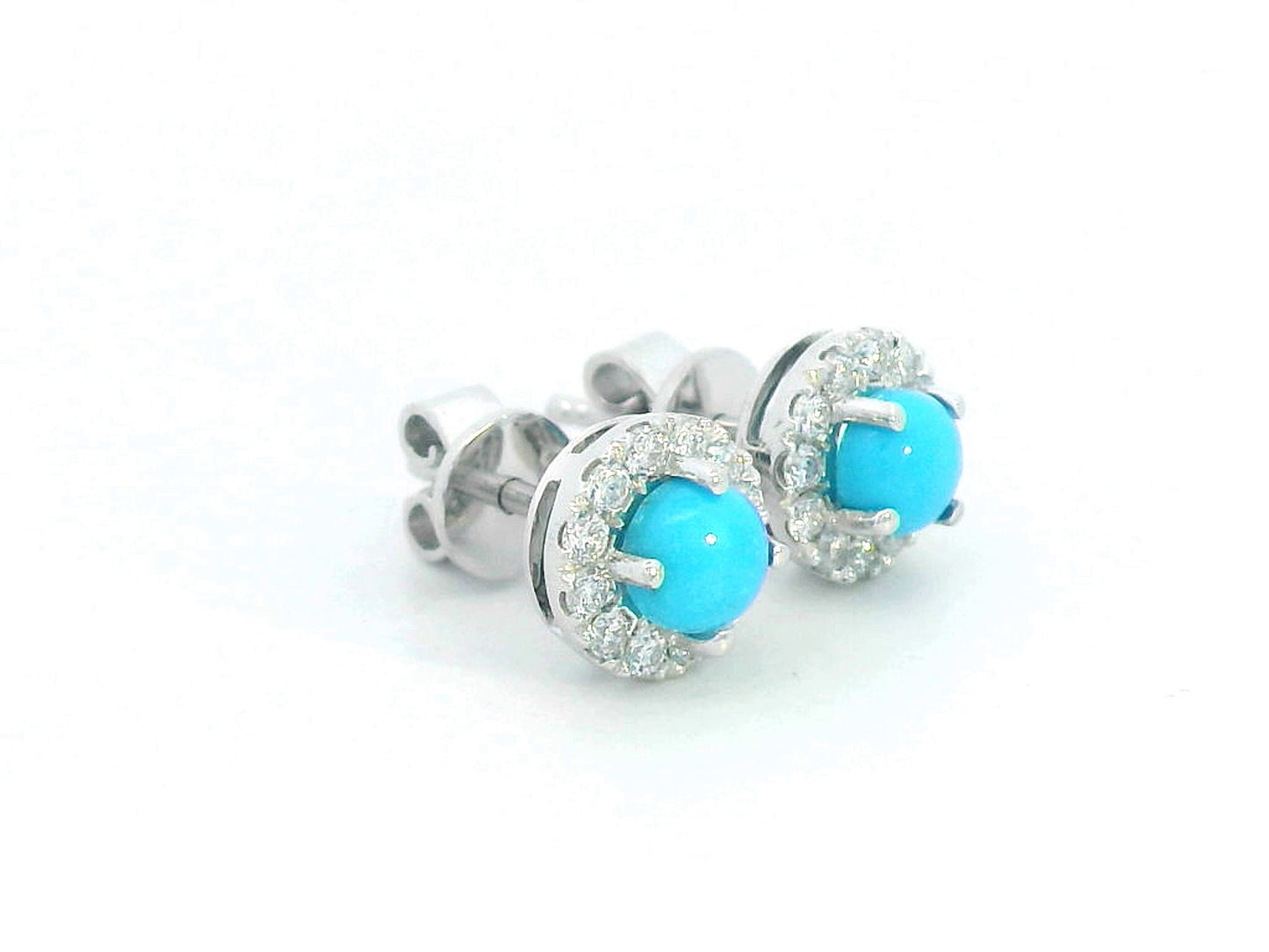 18K white gold stud earrings with round turquoise centers and diamond halo accents.
