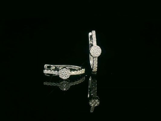 Diamond huggie hoop earrings in 18K gold with  round diamond cluster