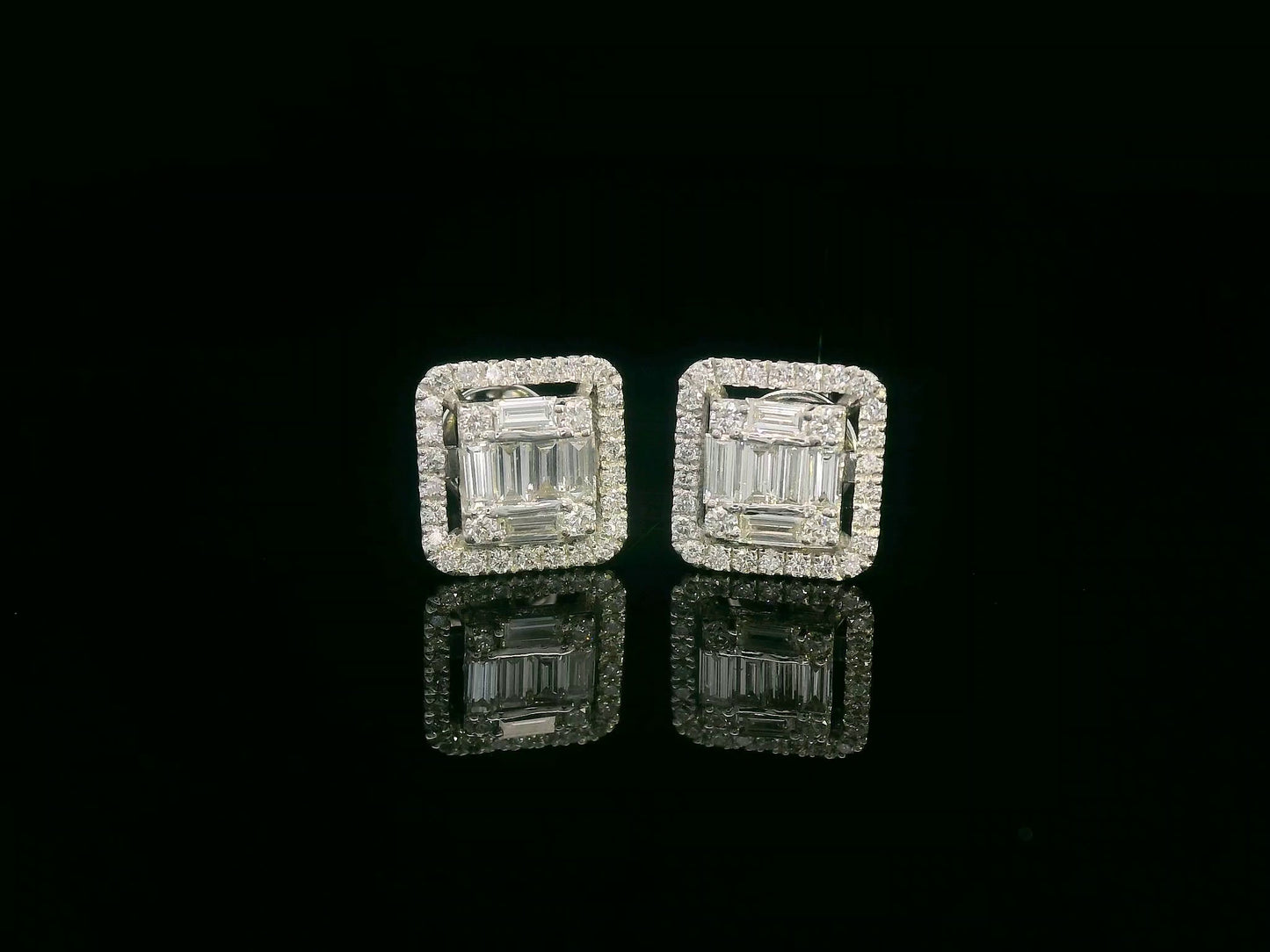 18K gold diamond cluster stud earrings with 0.56 carats of round and baguette-cut diamonds, featuring a secure butterfly back.