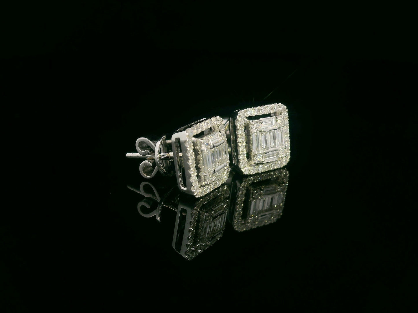 18K gold diamond cluster stud earrings with 0.56 carats of round and baguette-cut diamonds, featuring a secure butterfly back.