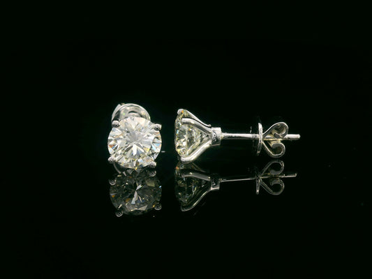 18K gold diamond stud earrings with 1.01ct IGI certified VS2 I color diamonds in solitaire prong setting