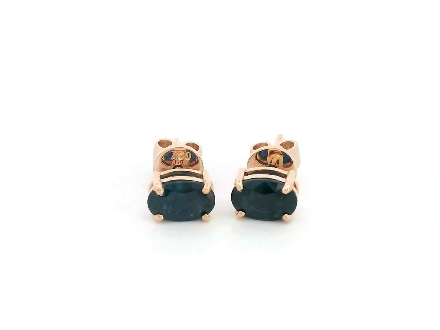 18K rose gold stud earrings with oval-cut natural blue sapphires totaling 1.06 carats, four-prong set with butterfly push backs.