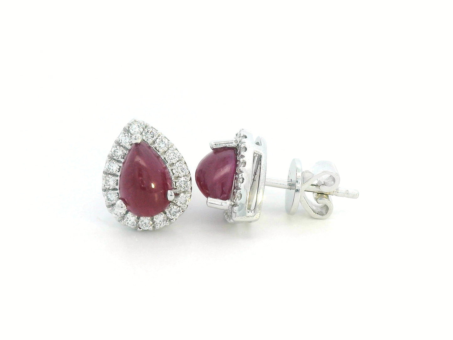 18K gold ruby earrings with pear-shaped 2.21 CT cabochon rubies and diamond halo accents.