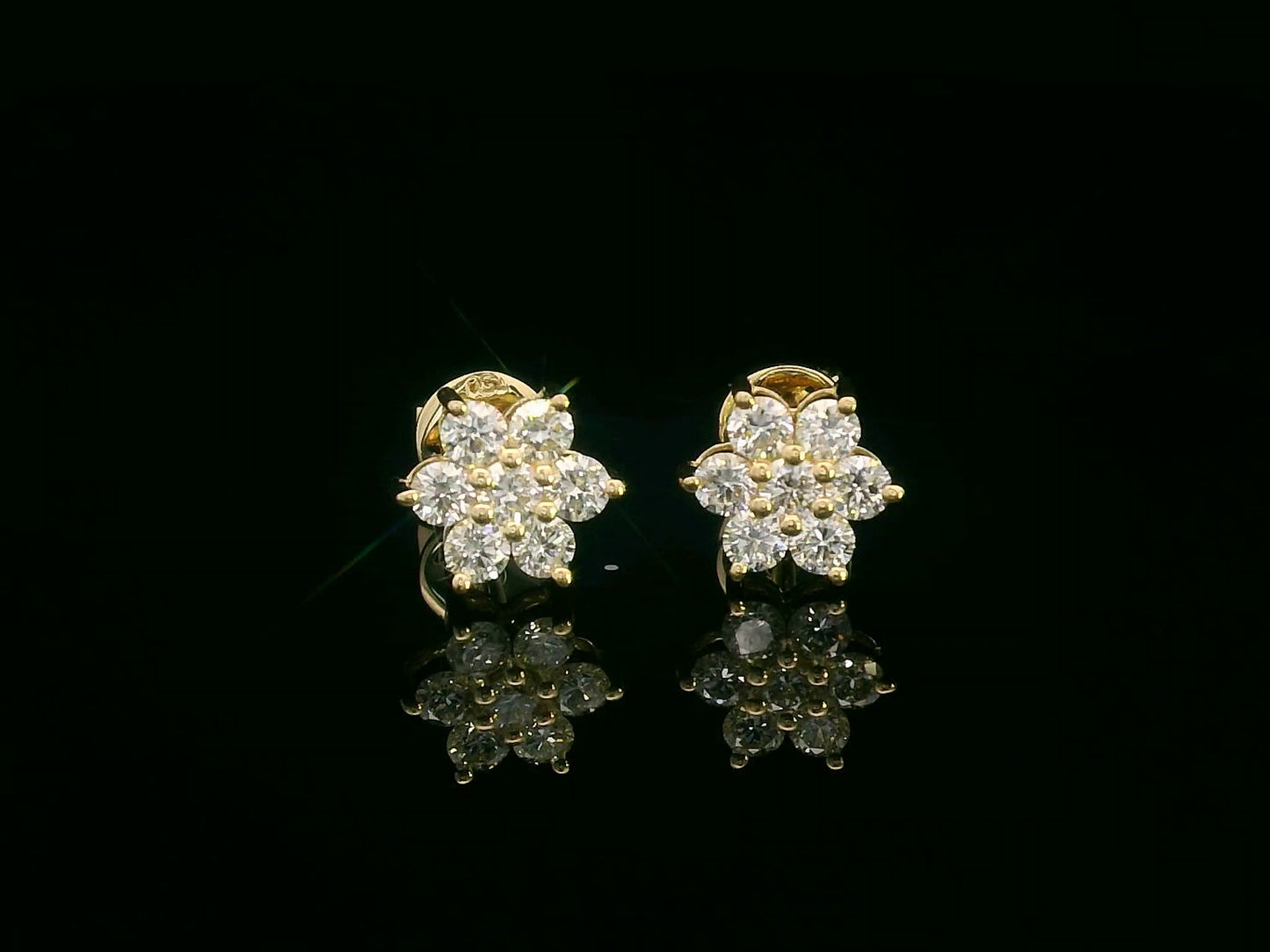 Floral diamond stud earrings in 18K yellow gold with round cut diamonds, 0.62 carat total weight