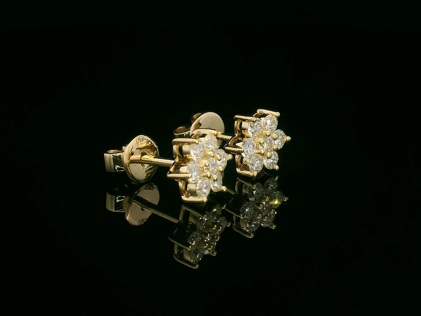 Floral diamond stud earrings in 18K yellow gold with round cut diamonds, 0.62 carat total weight