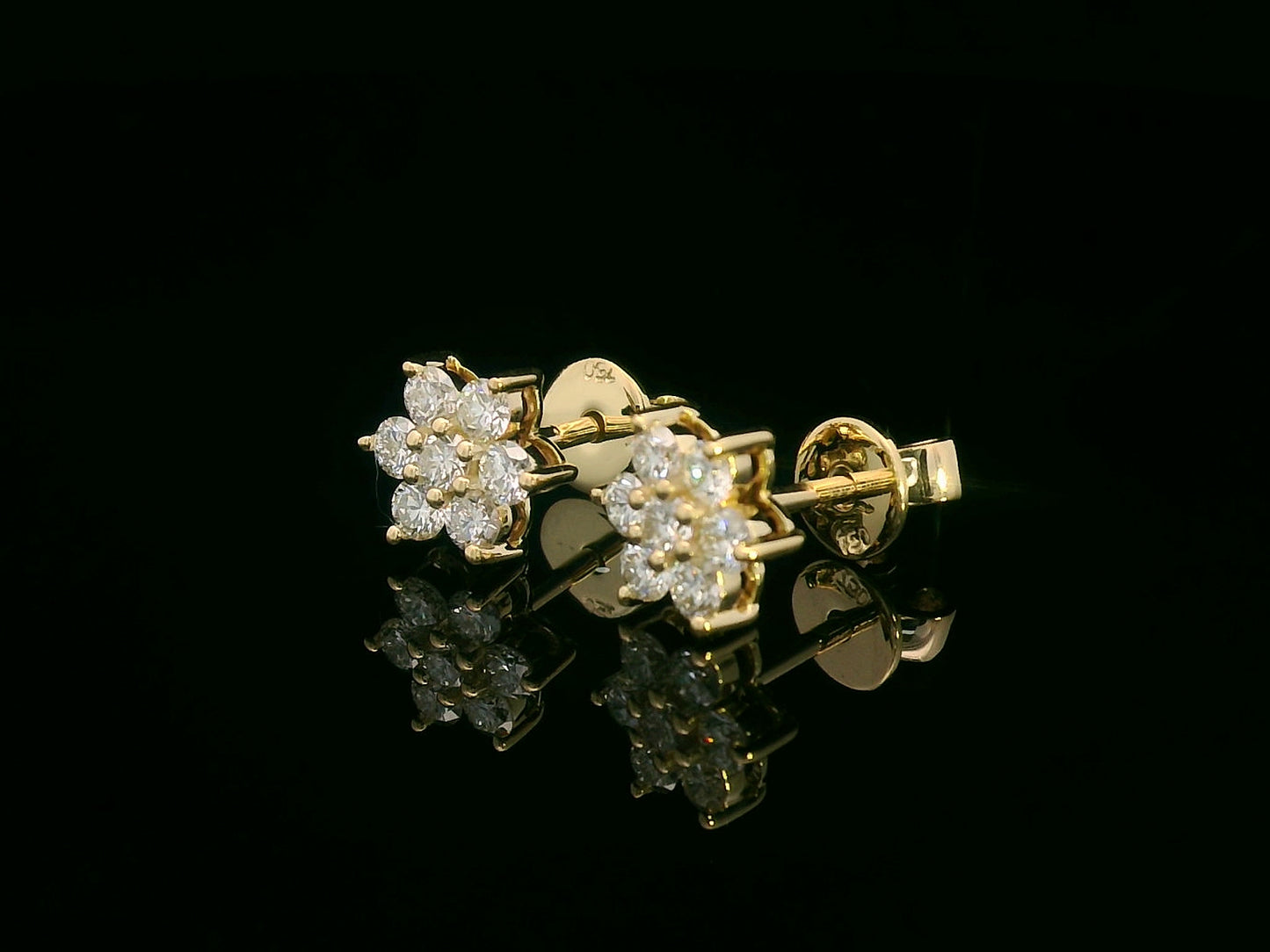 Floral diamond stud earrings in 18K yellow gold with round cut diamonds, 0.62 carat total weight