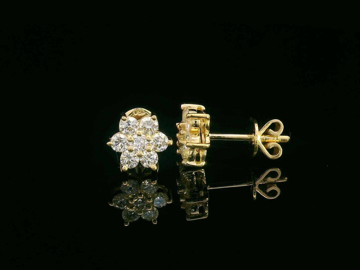 Floral diamond stud earrings in 18K yellow gold with round cut diamonds, 0.62 carat total weight