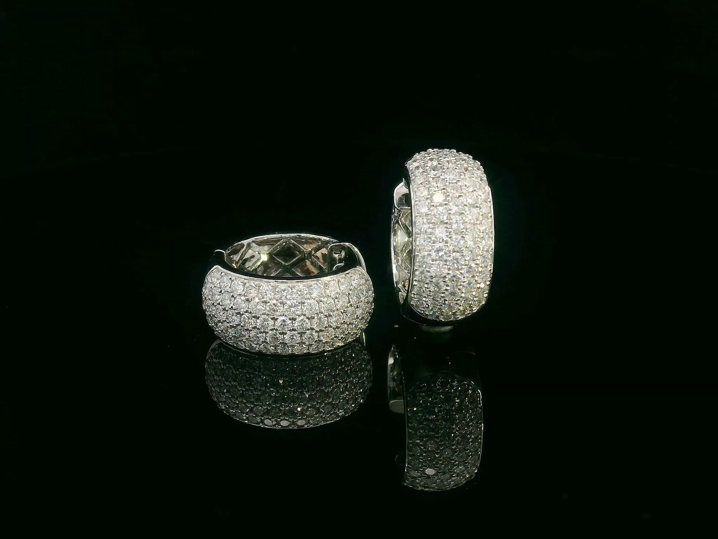 18K white gold pavé diamond huggie hoop earrings with wide dome design and 2.26 carat diamonds