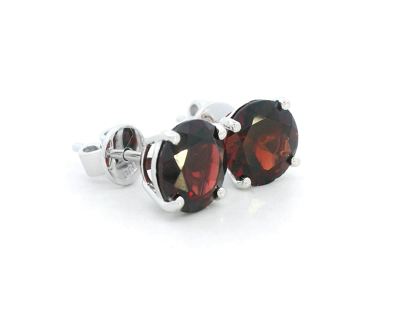 3.89 carat round Garnet stud earrings in 18K white gold with four-prong solitaire setting