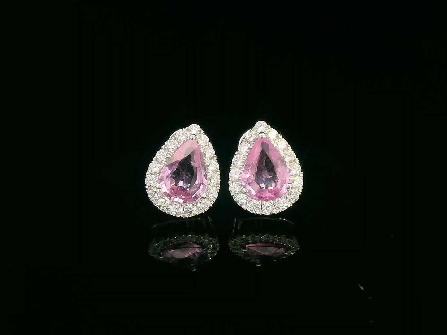 Pear-shaped pink sapphire stud earrings with diamond halo in 18K white gold – 1.38ct sapphires and 0.33ct diamonds