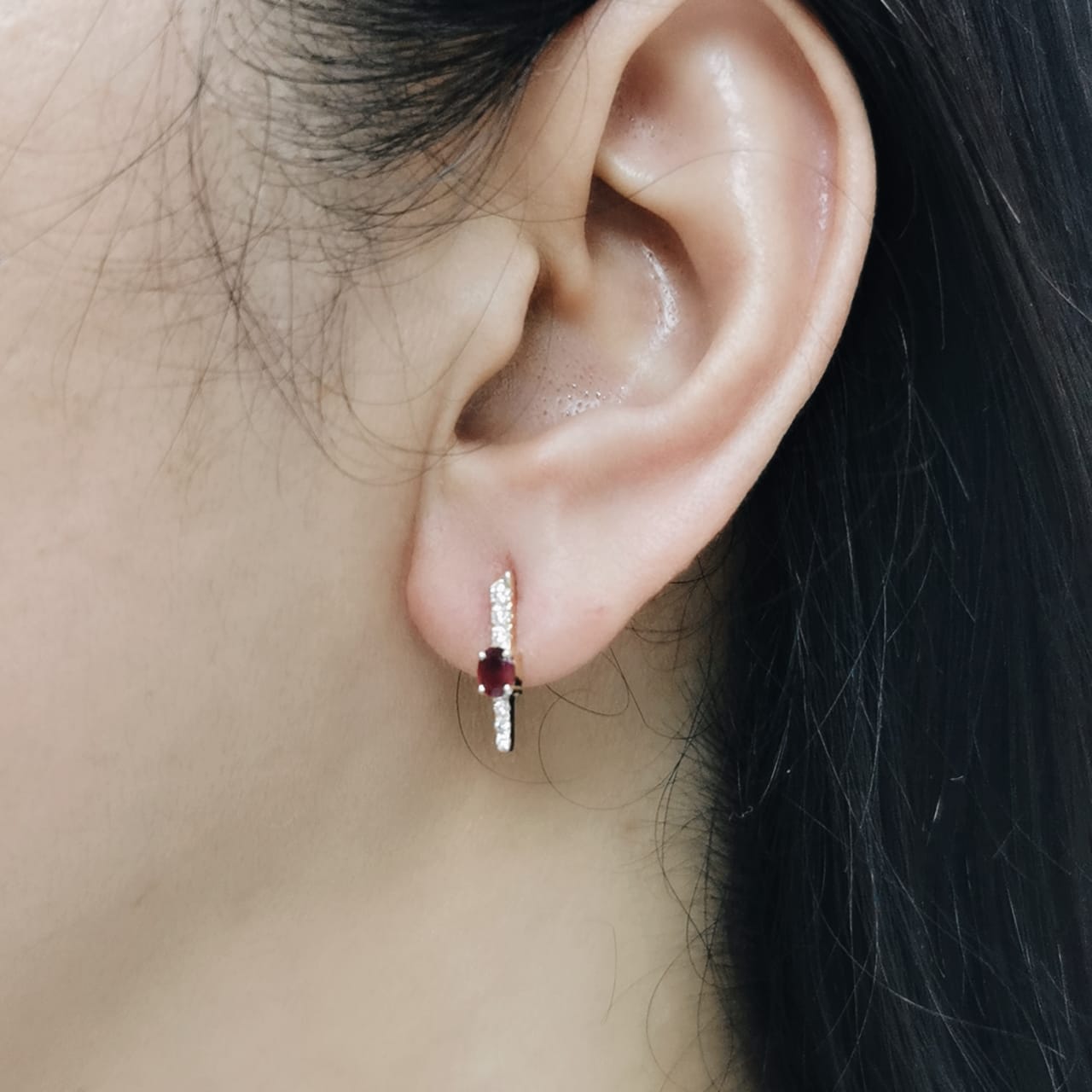 18K gold vertical earrings with 0.51ct oval rubies and 0.16ct round diamonds in a linear design with screw-back posts