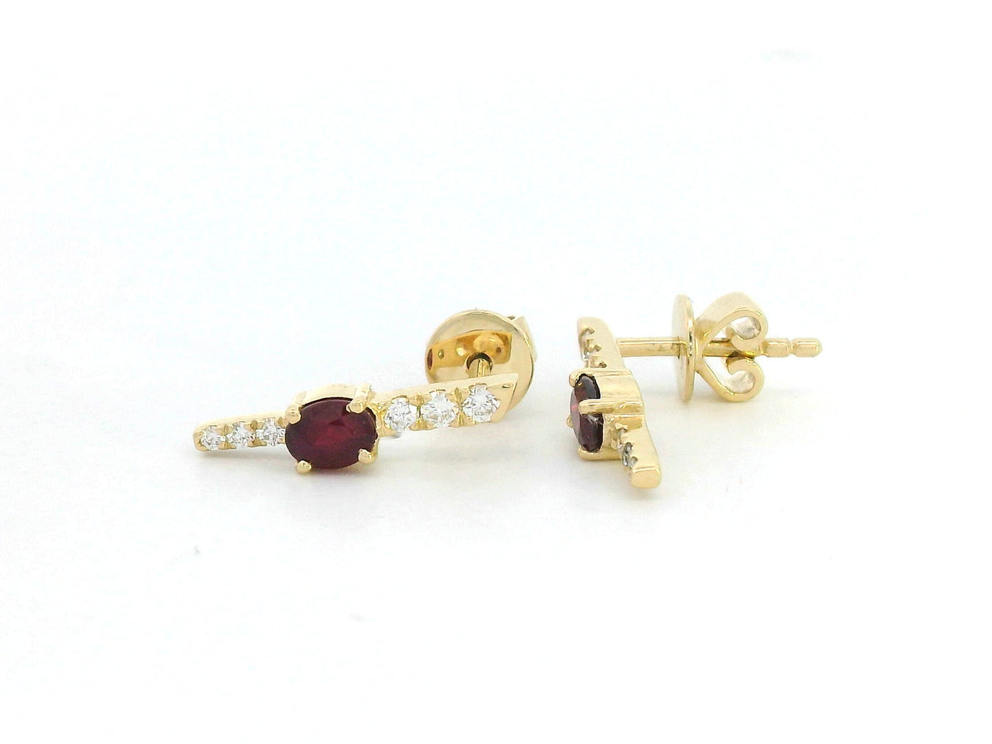 18K gold vertical earrings with 0.51ct oval rubies and 0.16ct round diamonds in a linear design with screw-back posts