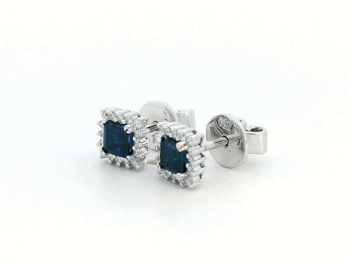 Square-cut sapphire halo stud earrings in 18K white gold with diamond accents