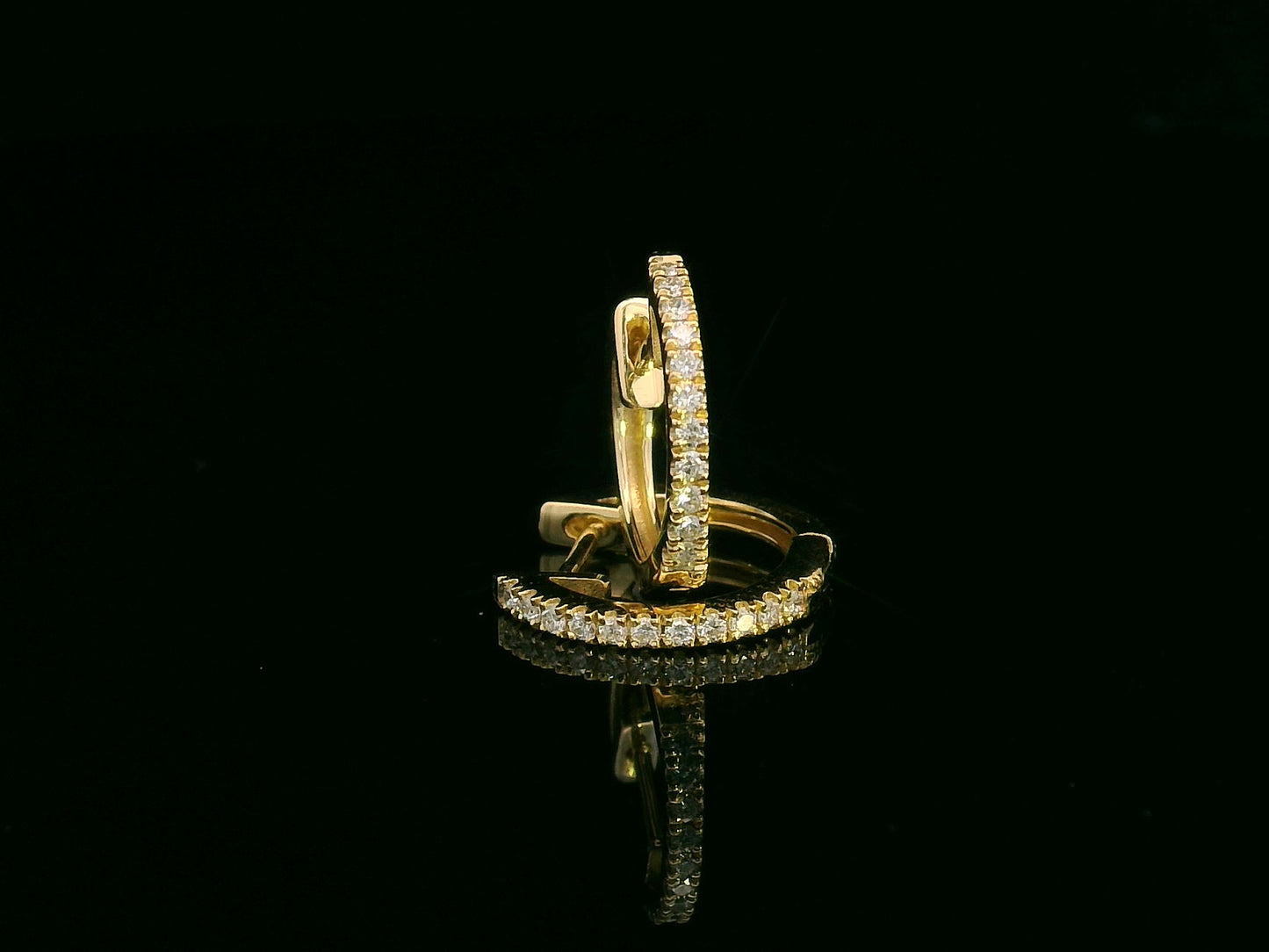 Unisex 18K gold huggie hoop earrings with 0.12 carat pavé diamonds, minimalist design