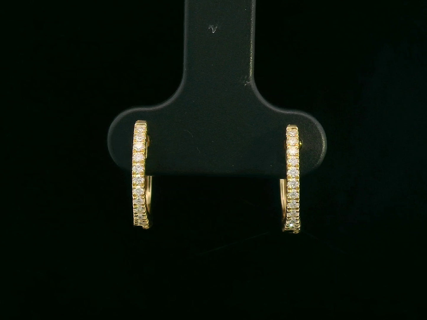18K yellow gold diamond huggie hoop earrings – pavé-set 0.12ct diamonds by Emirates Diamonds