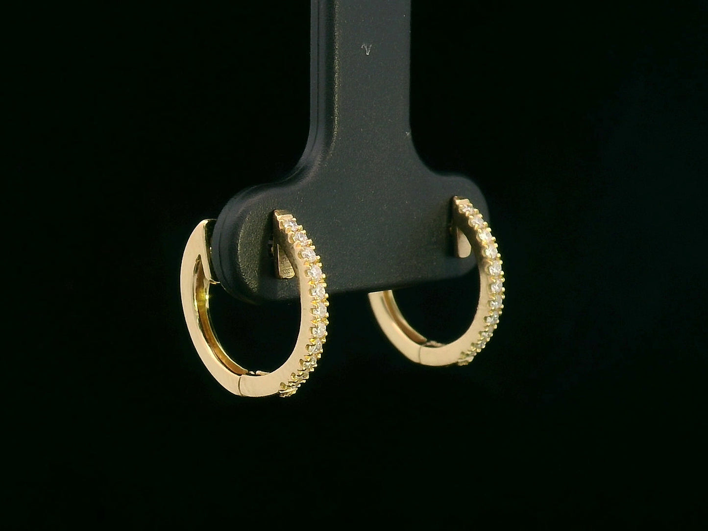 Unisex 18K gold huggie hoop earrings with 0.12 carat pavé diamonds, minimalist design