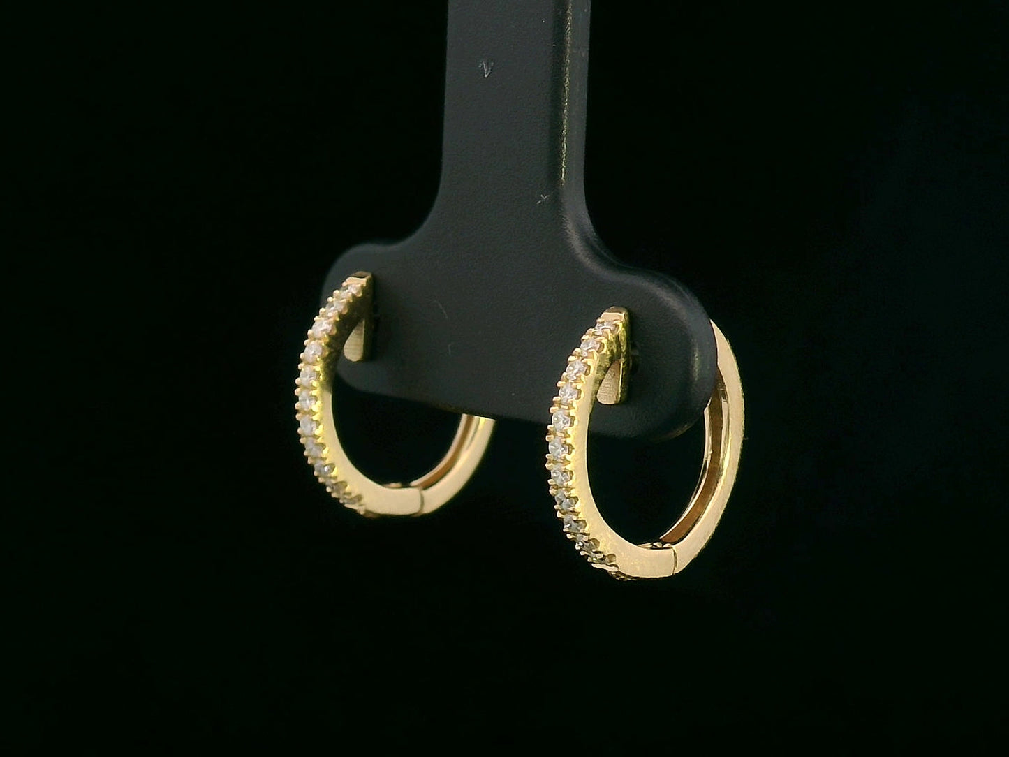 Unisex 18K gold huggie hoop earrings with 0.12 carat pavé diamonds, minimalist design
