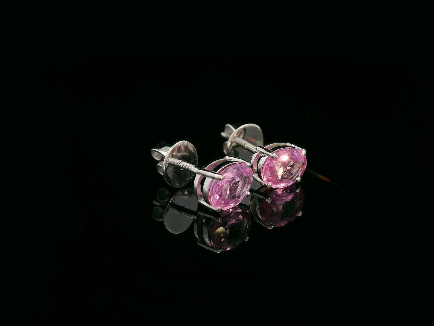 18K white gold stud earrings set with 1.66 carat pink sapphires