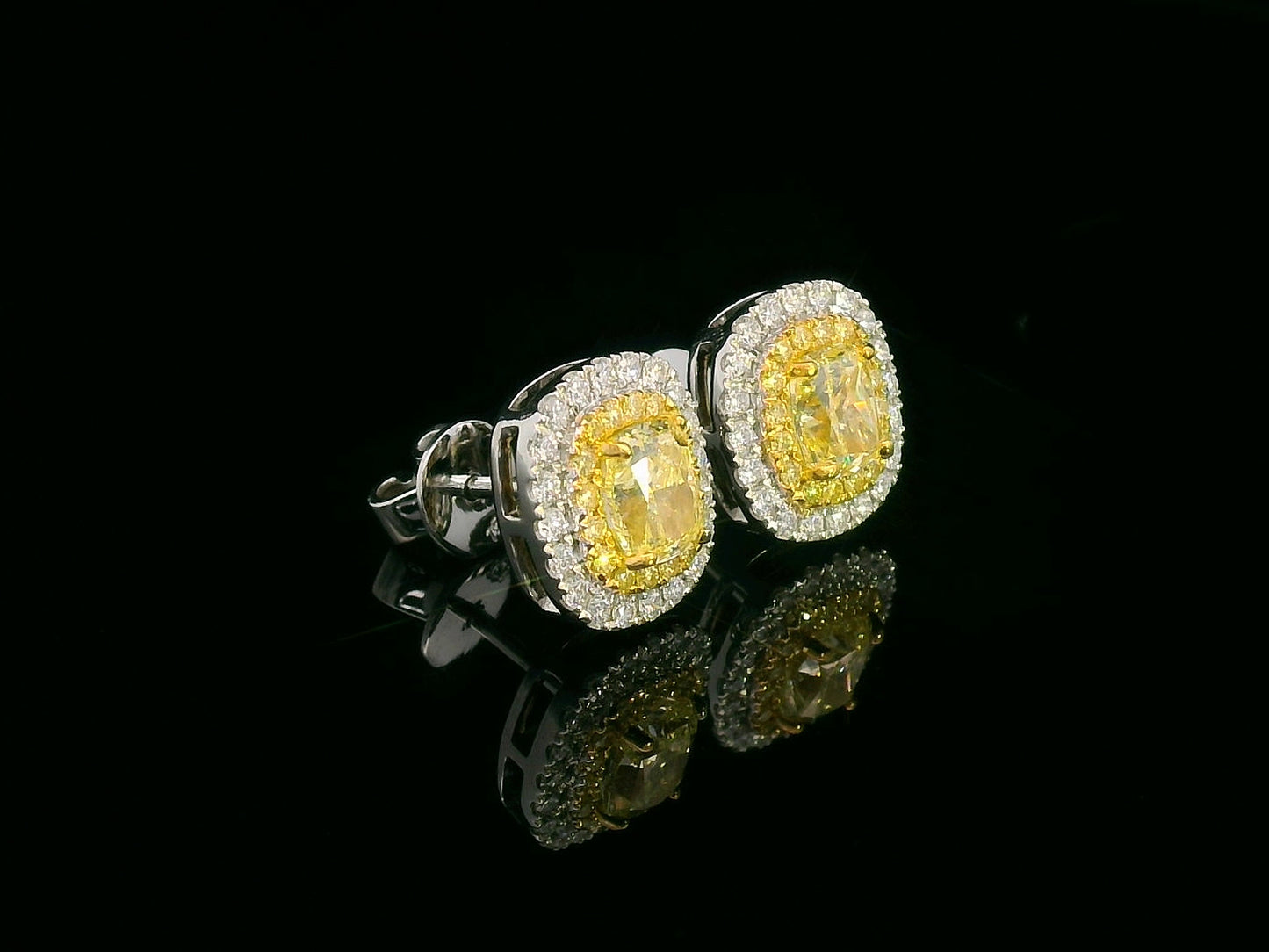 18K gold fancy yellow diamond halo stud earrings with white diamond border – Emirates Diamonds