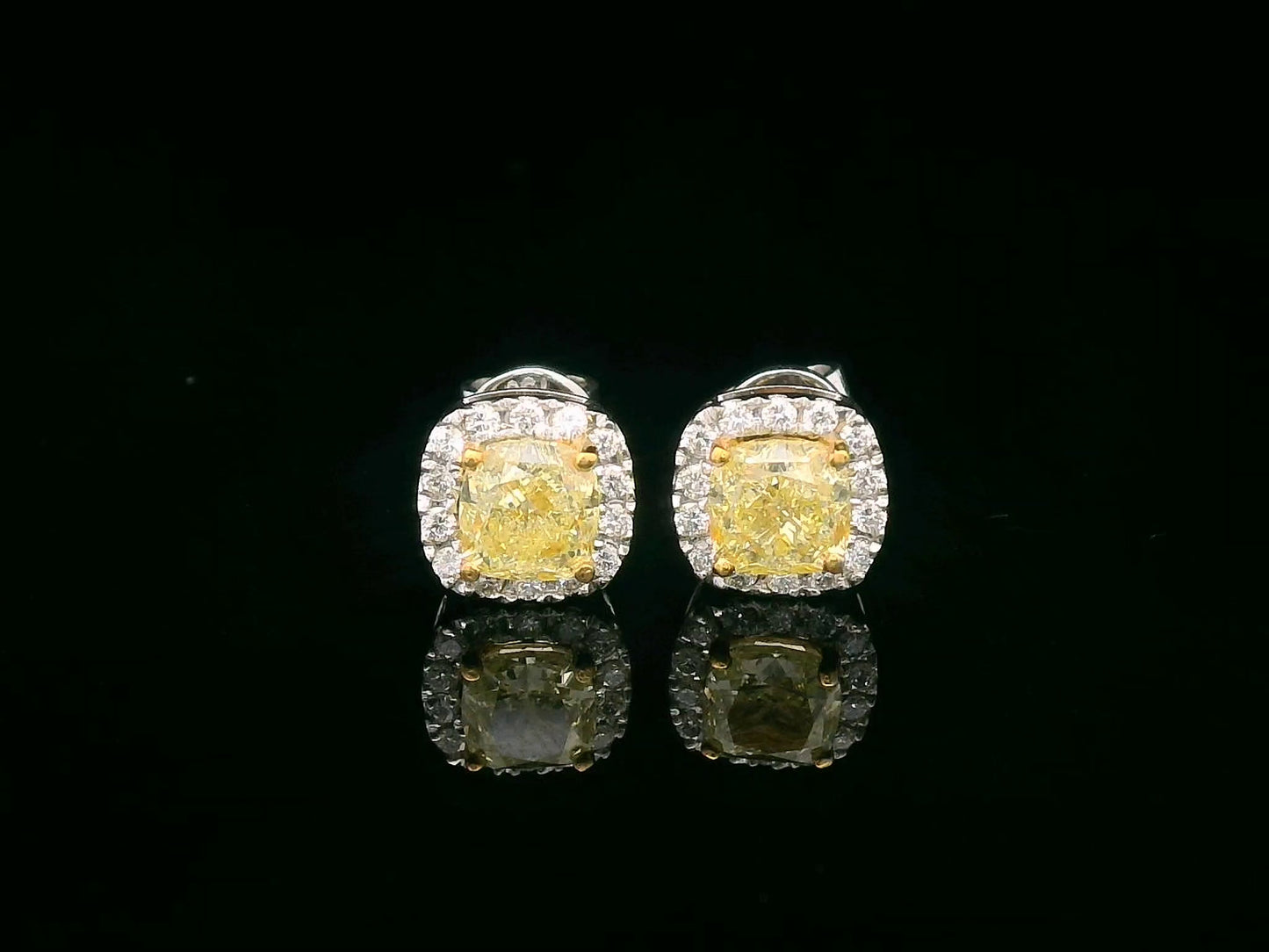 Cushion-Cut Fancy Yellow Diamond Stud Earrings with White Diamond Halo in 18K White Gold