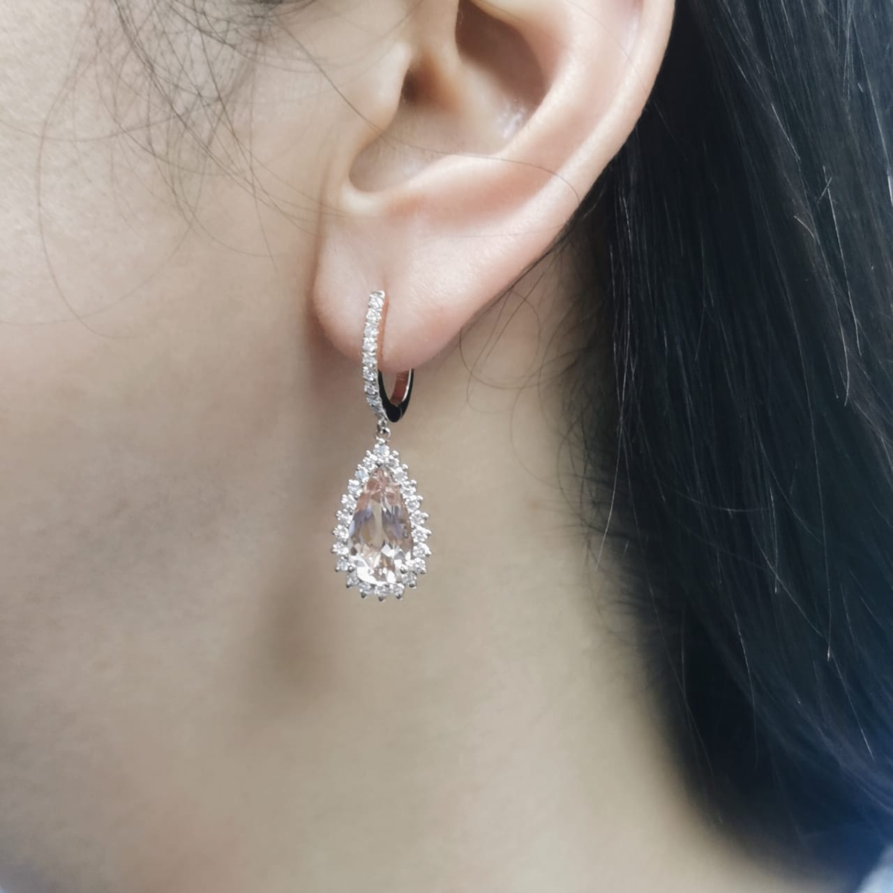 18K rose gold earrings with pear-shaped morganite and starburst diamond halo on pavé huggie hoops