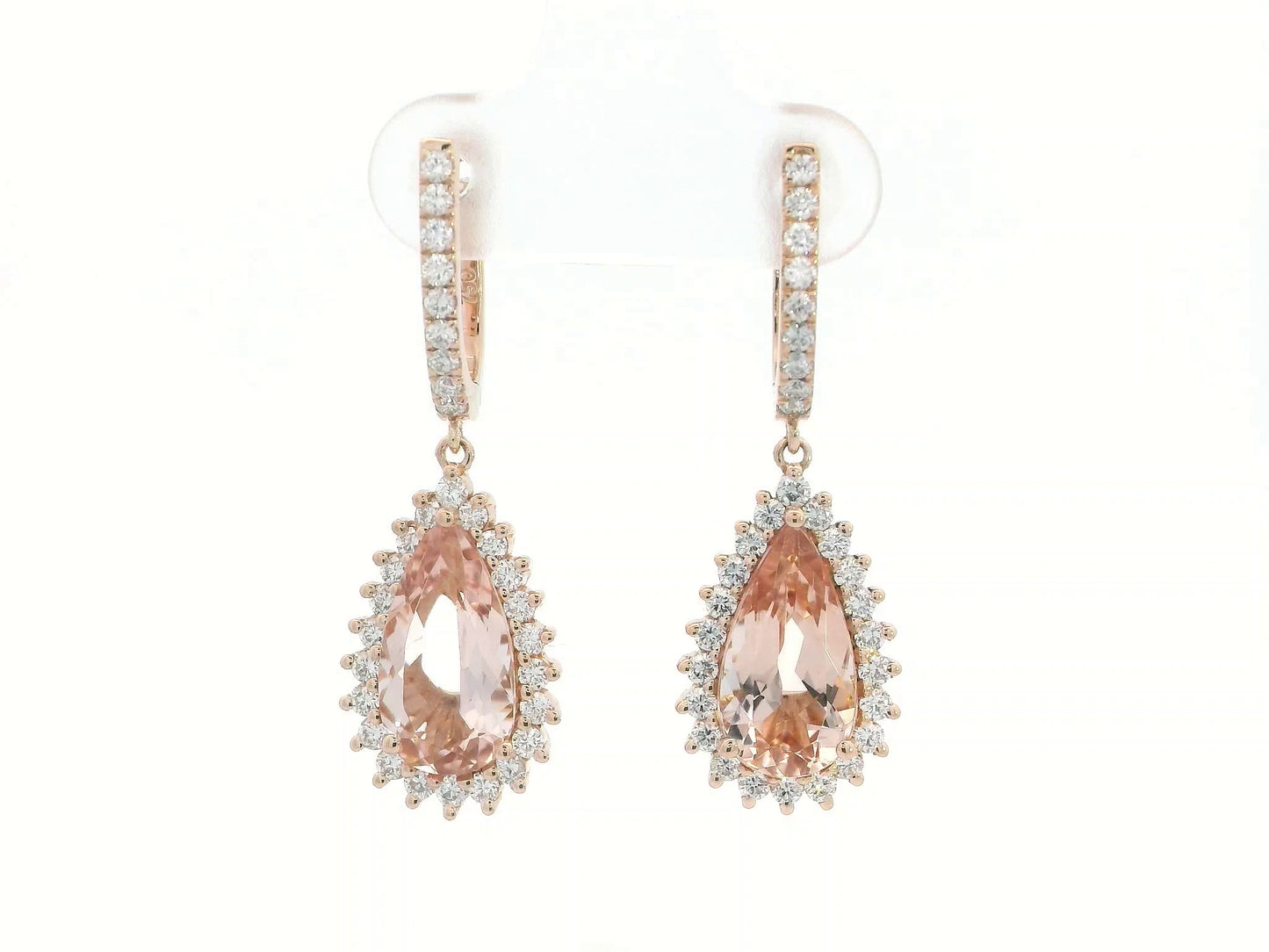 18K rose gold earrings with pear-shaped morganite and starburst diamond halo on pavé huggie hoops