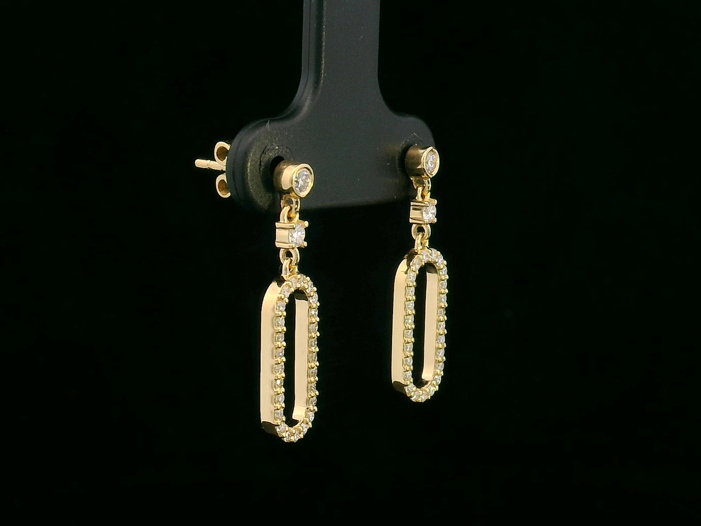18K yellow gold geometric drop earrings with bezel and pavé diamonds, open oval link design