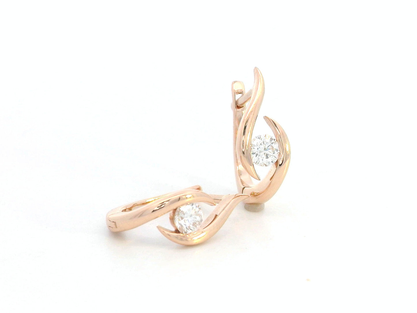 18K rose gold earrings with curved twist design and center round diamond