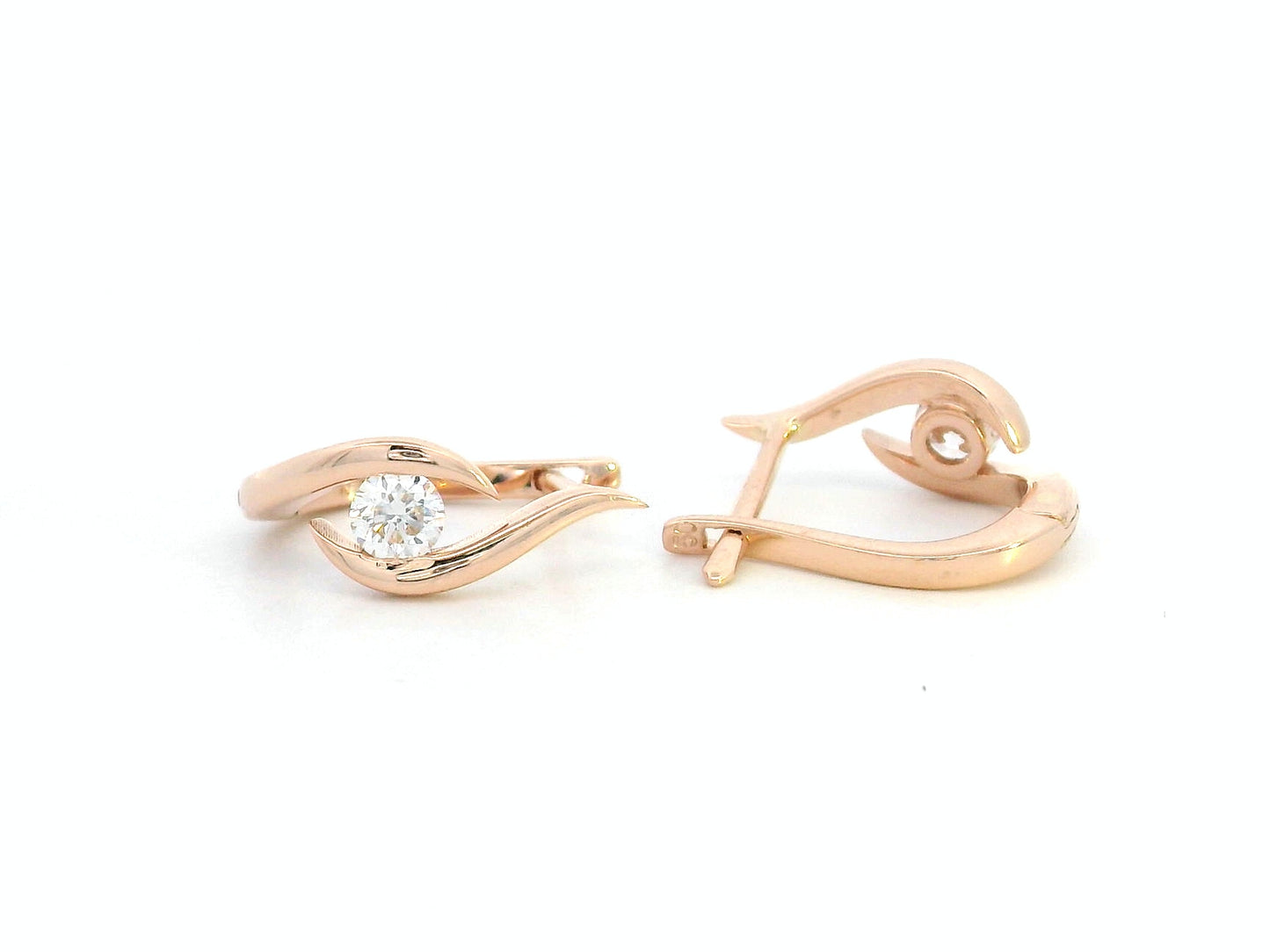 18K rose gold earrings with curved twist design and center round diamond
