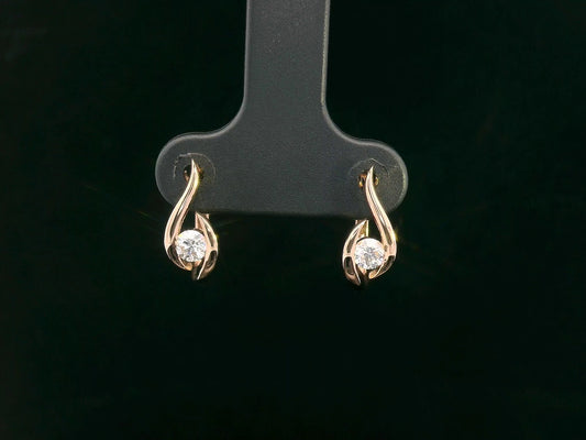 18K rose gold earrings with curved twist design and center round diamond