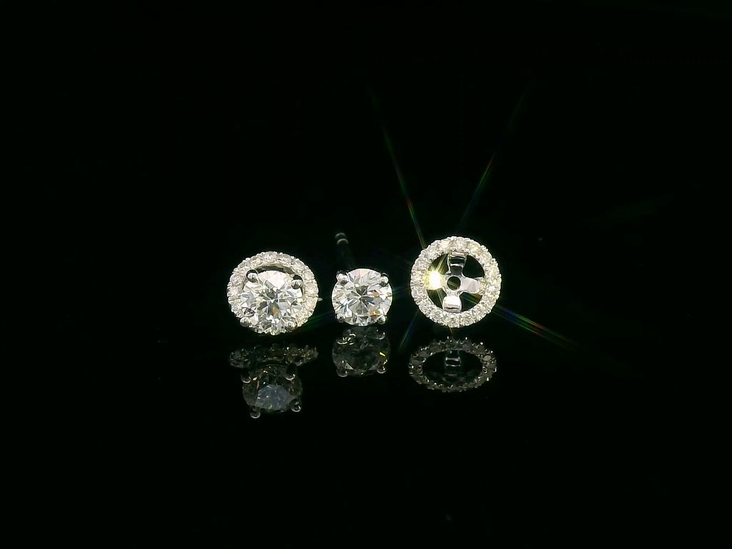 Convertible diamond stud earrings in 18K white gold with detachable halo setting, 0.61 carat total weight