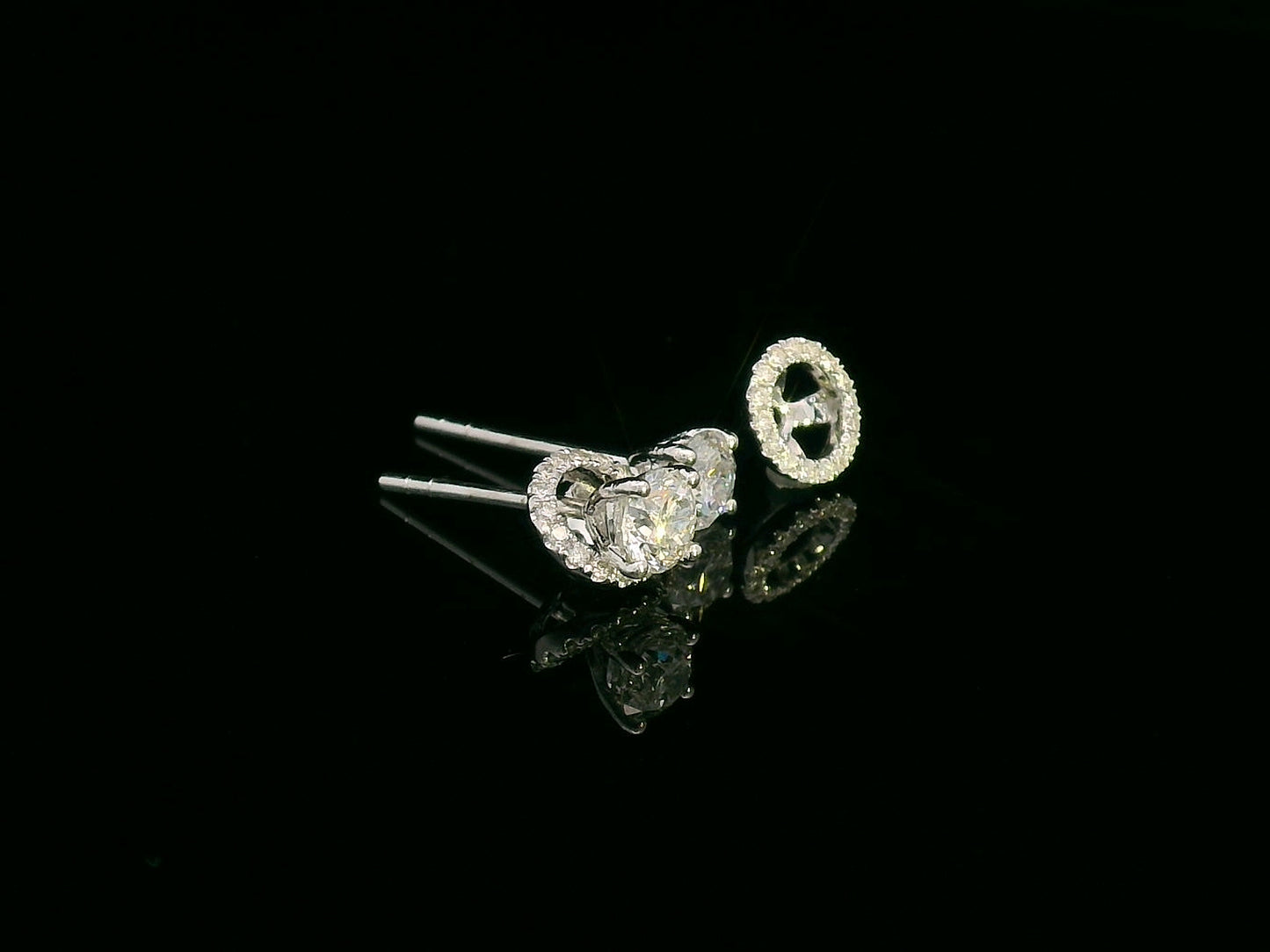 Convertible diamond stud earrings in 18K white gold with detachable halo setting, 0.61 carat total weight