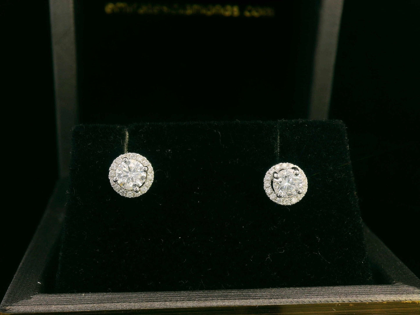 Convertible diamond stud earrings in 18K white gold with detachable halo setting, 0.61 carat total weight