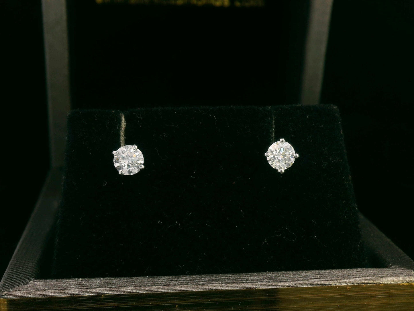 Convertible diamond stud earrings in 18K white gold with detachable halo setting, 0.61 carat total weight