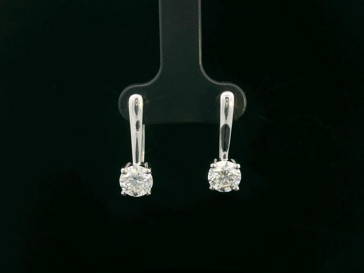 18K white gold diamond drop earrings with 1.01ct and 1.02ct round-cut GIA-certified diamonds in four-prong setting